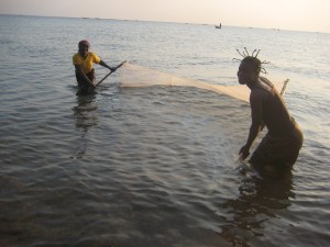 Women use bed nets to fish fry on the shores of Lake Tanganyika. We need further study to understand the full impact of this practice